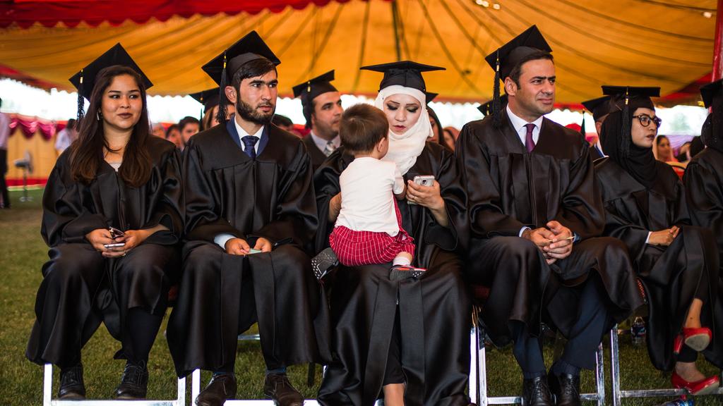 Students graduate from American University of Afghanistan a year on from deadly attack