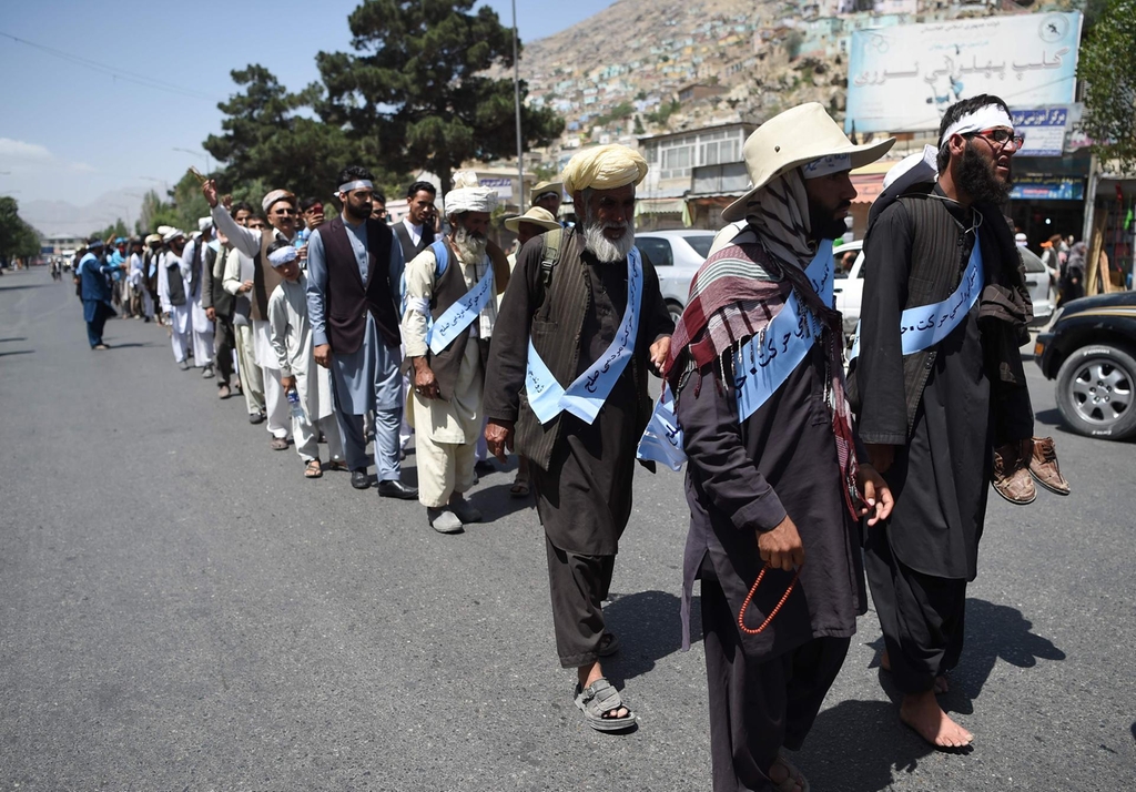 Afghan peace marchers tired and war-weary after Taliban ends truce