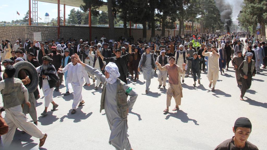 Afghan attempt to rein in warlords faces backlash as violent protests spread